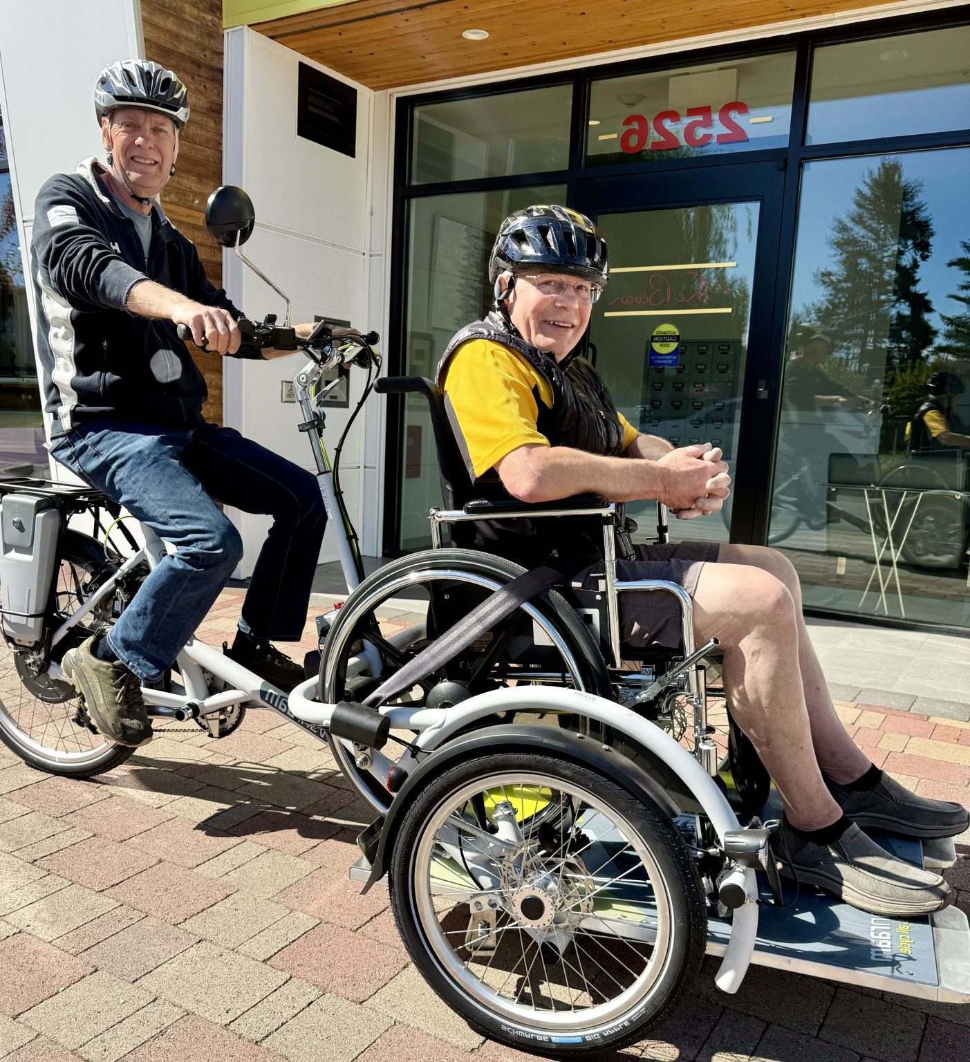 Pilot and Passenger enjoy a ride on a Velo Plus wheel chair tricycle.